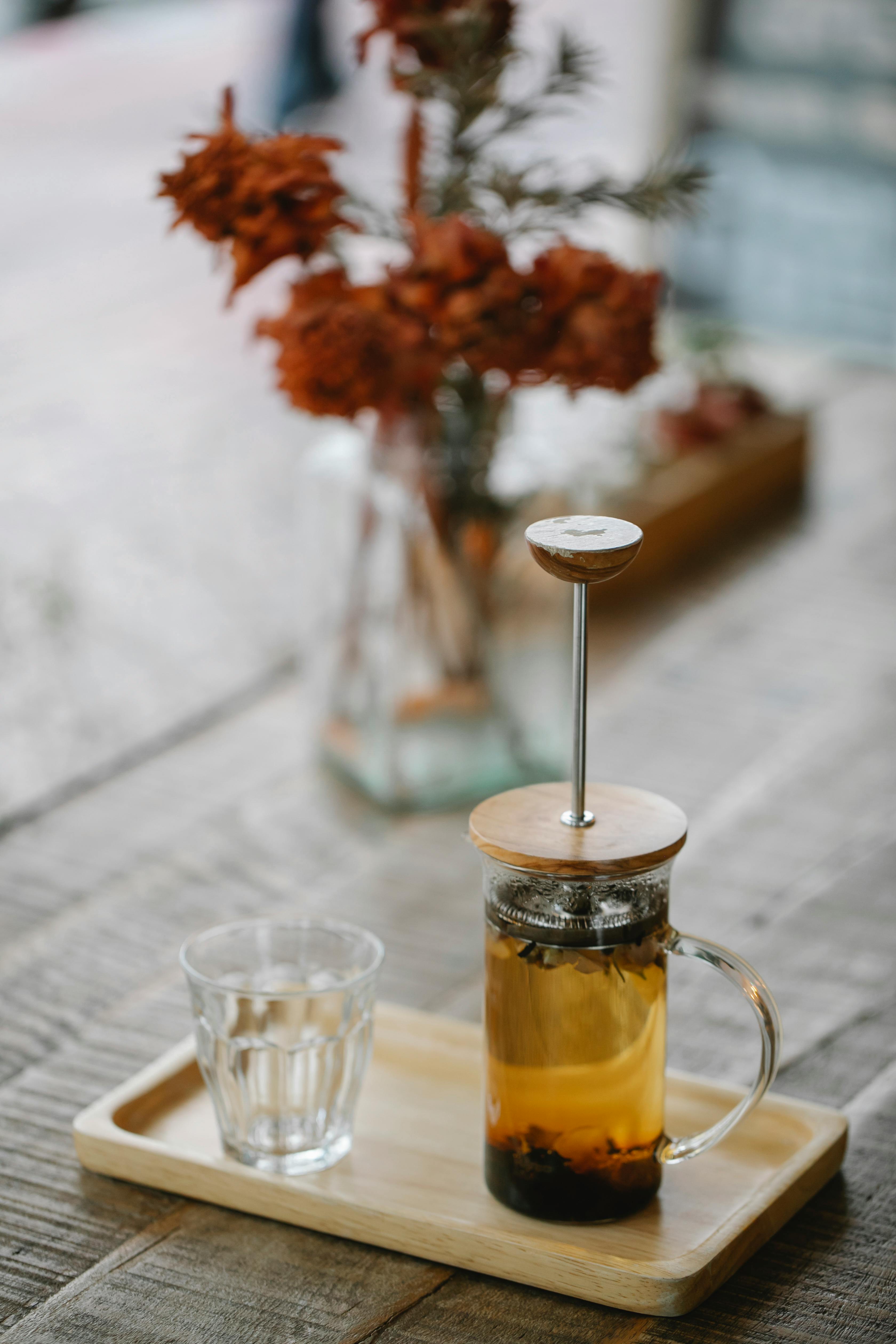 teapot and glass on tray in cafe