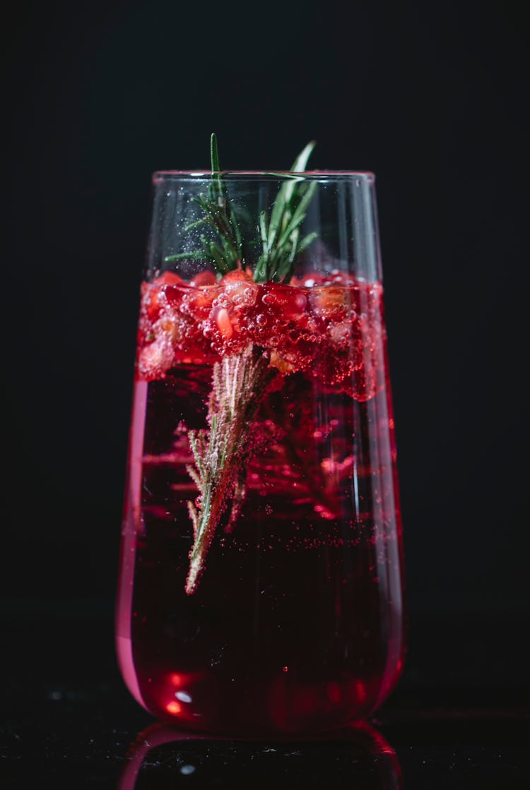 Glass Of Fresh Cocktail With Pomegranate And Rosemary