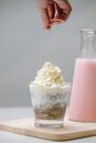 Woman decorating dessert in studio
