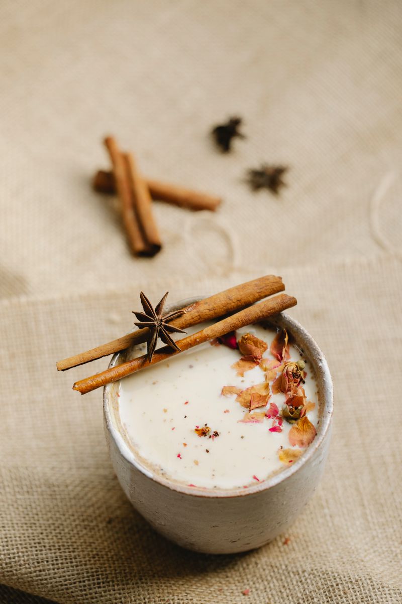 Ceramic mug of chai with cinnamon and star anise