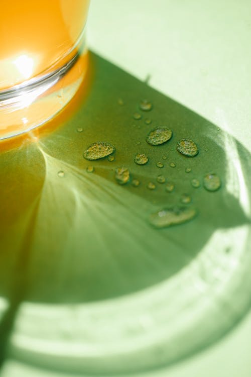 Water drops near glass of drink