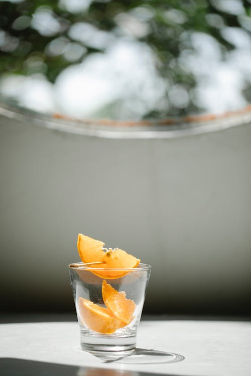 Free Pieces of orange in transparent glass Stock Photo