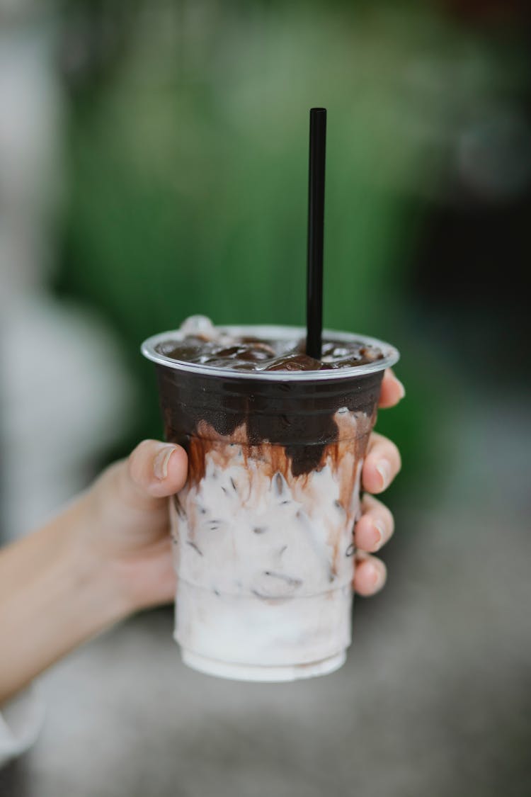 Unrecognizable Person With Cup Of Ice Coffee