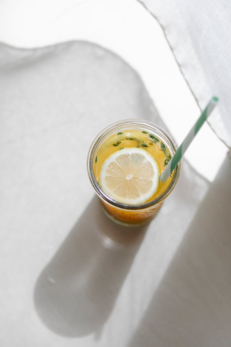 Homemade Lemonade In Glass With Straw