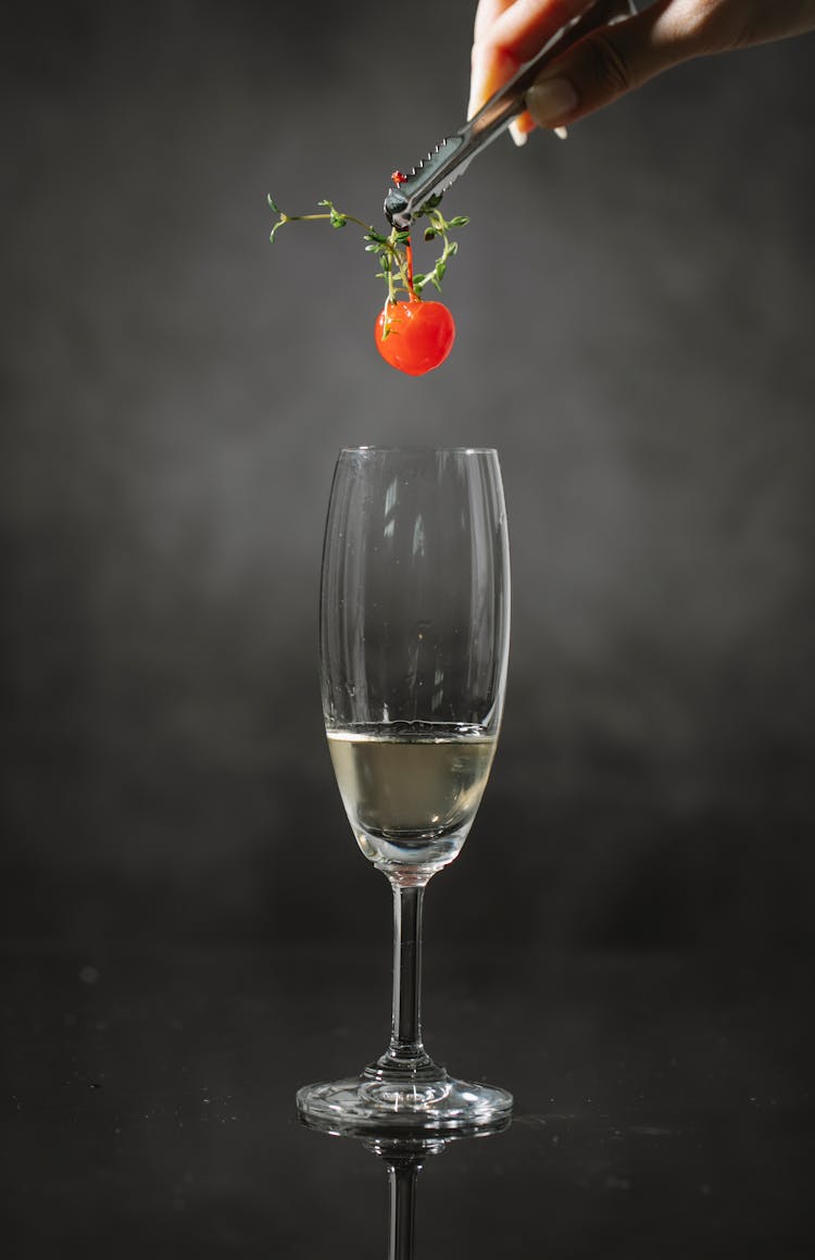 Crop Woman Adding Cherry In Drink