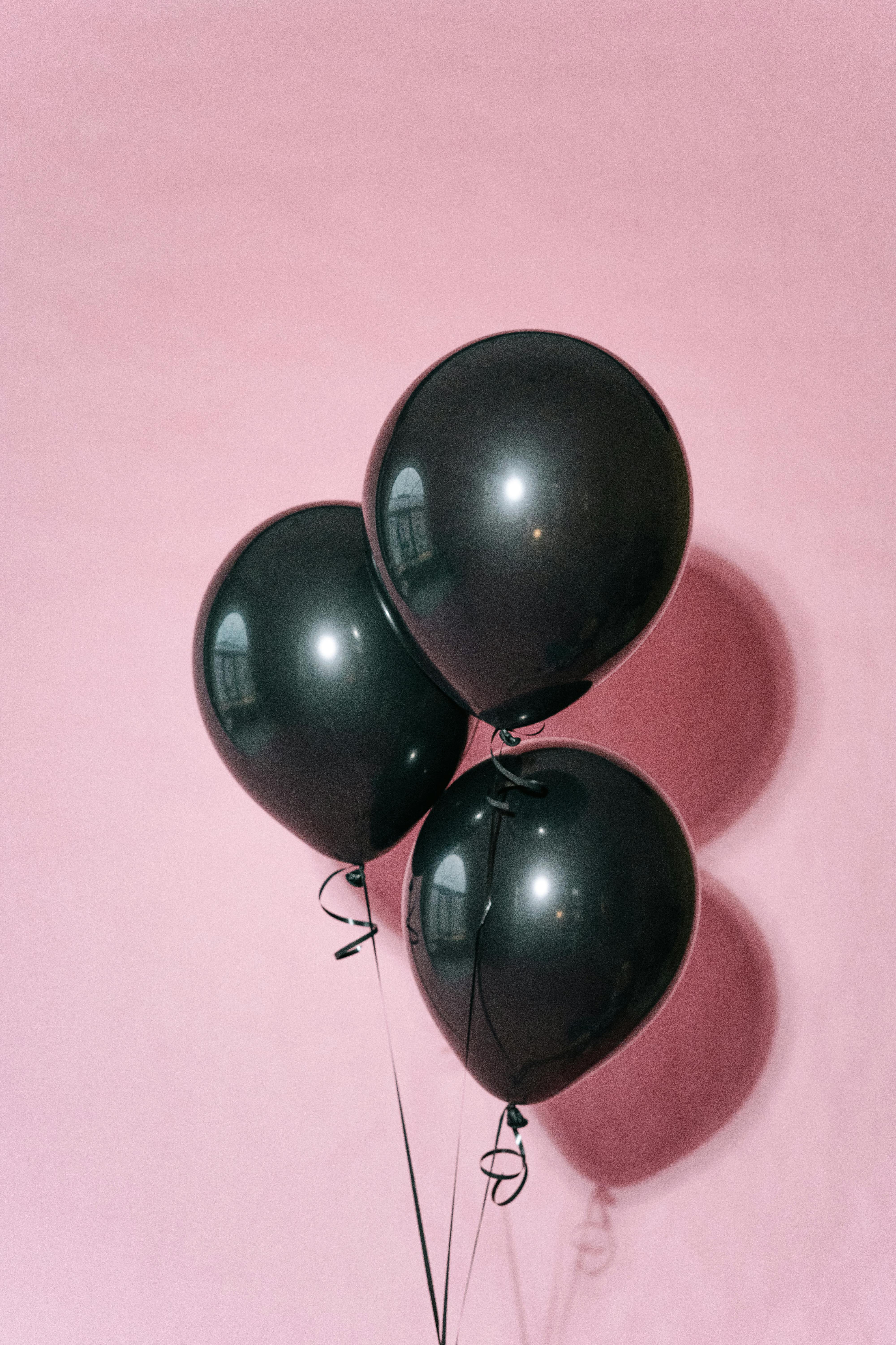 Black Balloons on Pink Background · Free Stock Photo