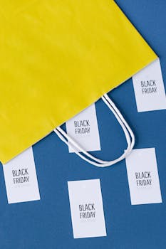 Colorful shopping scene with a yellow bag and Black Friday cards.