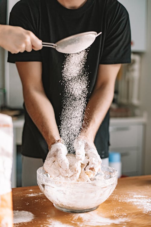 Free Person Holding a Dough in a Clear Bowl Stock Photo