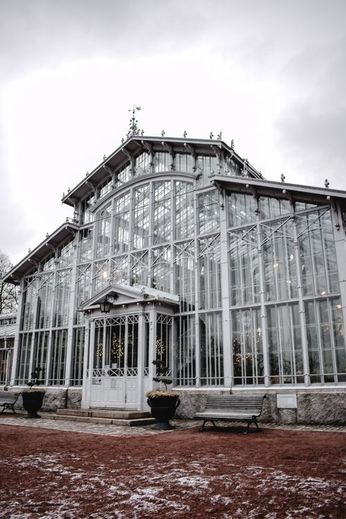 Free Stunning glass facade of a historic greenhouse in Helsinki, captured in winter. Stock Photo