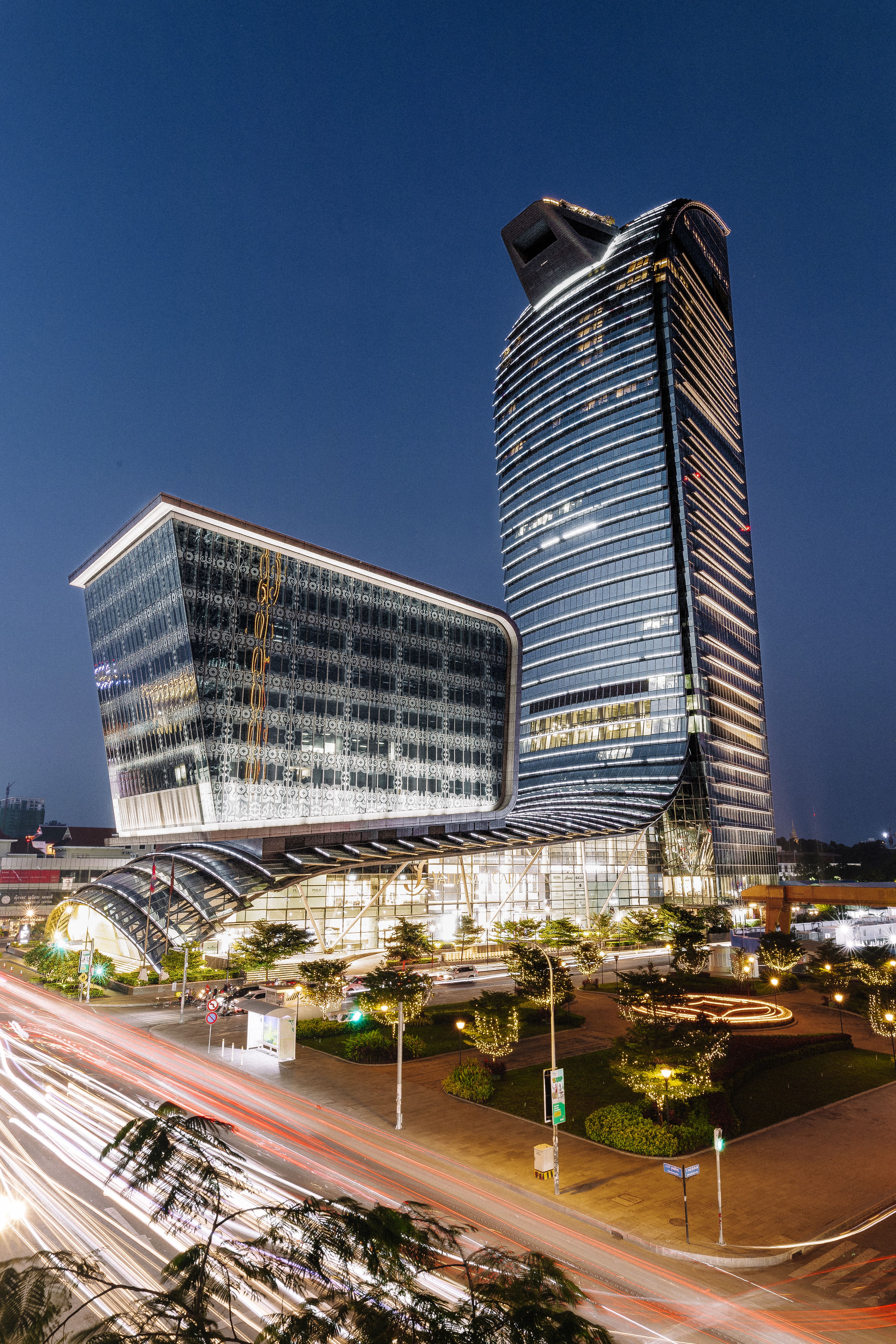Modern architecture of Vattanac Capital Tower illuminated at night in Phnom Penh, Cambodia.