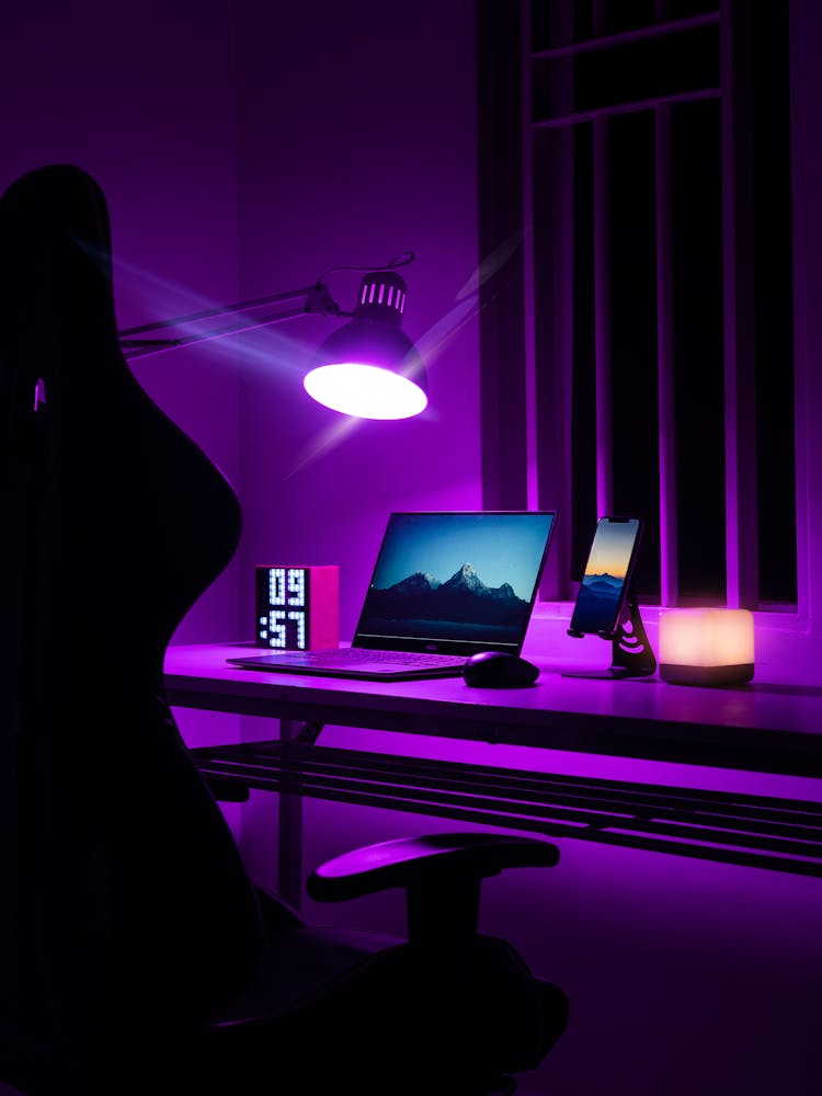 Laptop On Desk In Purple Room