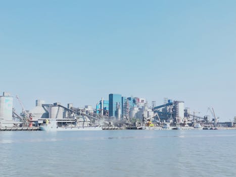 View of an industrial harbor with modern architecture and shipment activities in Bangladesh.