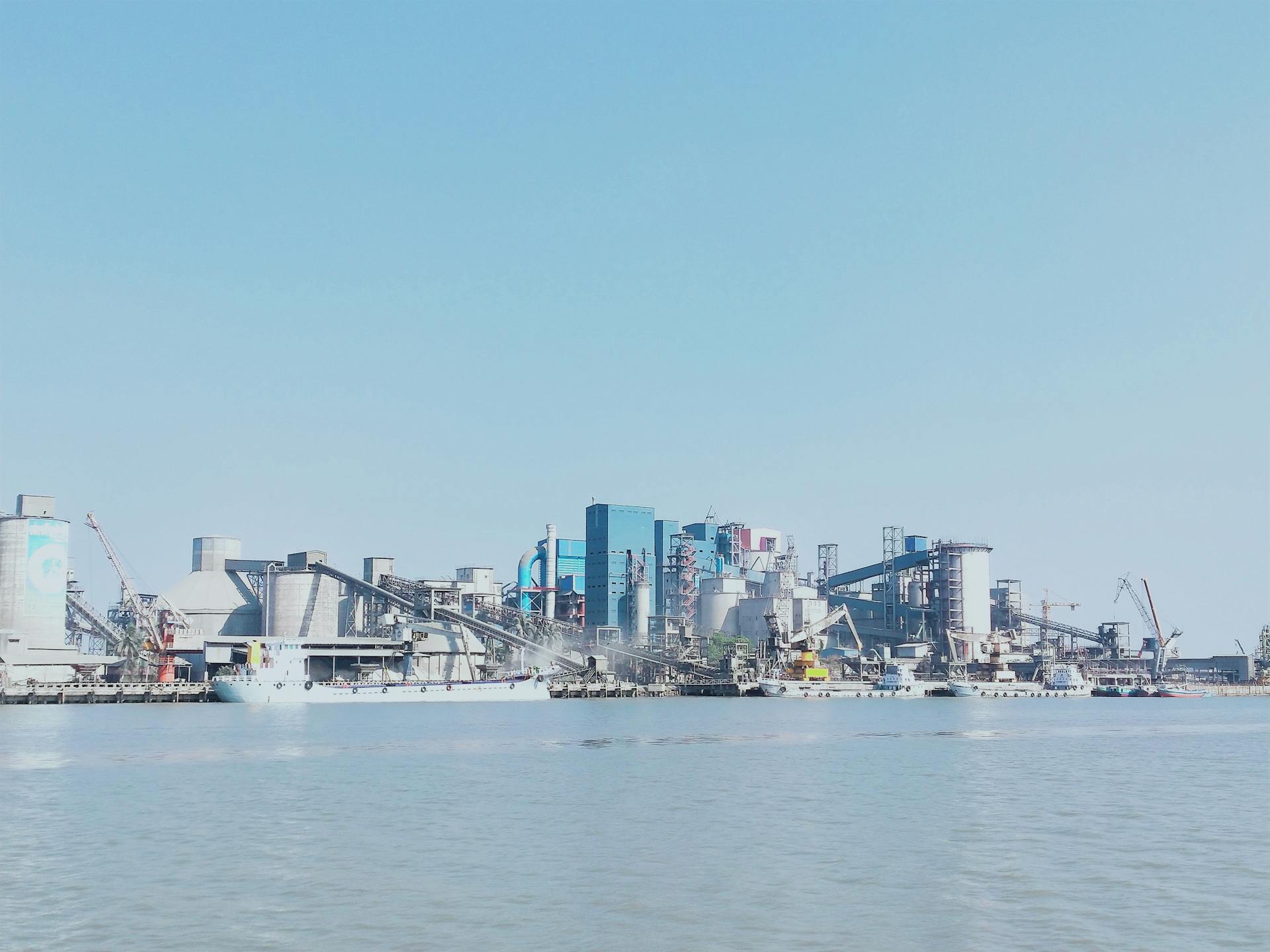 View of a Large Industry on the Shore under Blue Sky