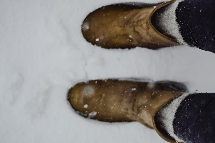 A Person Wearing Wool Socks Under Boots