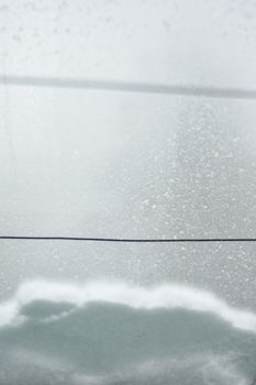 Snowfall in Estonia with wires cutting through the snowy landscape. A serene winter scene.