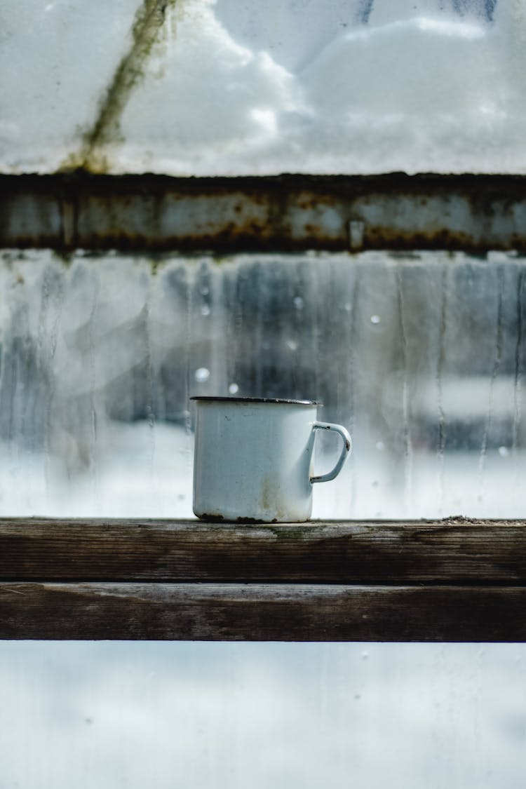 Enamel Mug On The Window Sill