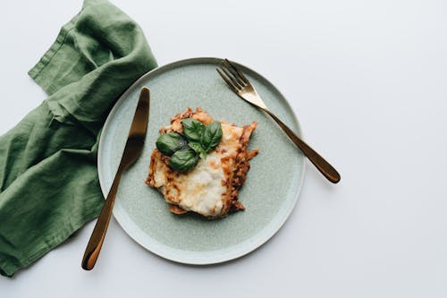 Cheesy Baked Lasagna Slice in an Earthenware 