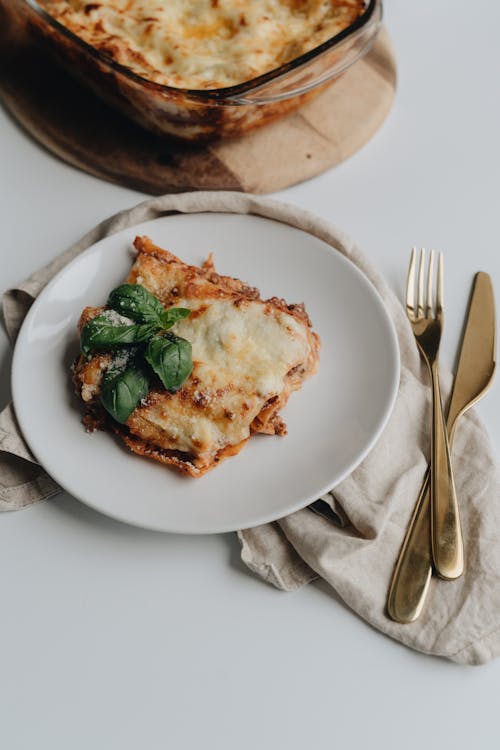 Free Baked Lasagna on a Ceramic Plate  Stock Photo