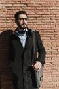 Man in Black Jacket Carrying a Messenger Bag