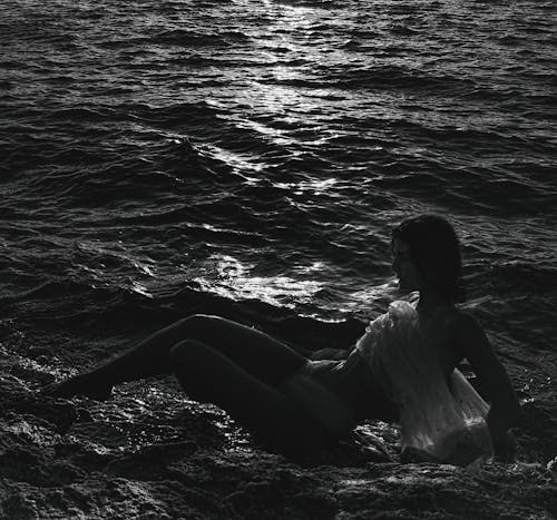 Free A Sexy Woman in a Rocky Coast Stock Photo