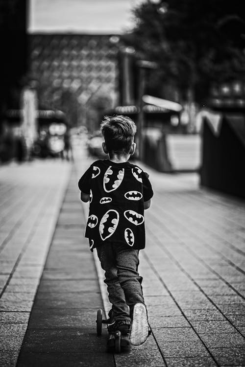 Child Riding a Kick Scooter