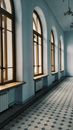 Interior design of spacious light hallway with arched windows and tiled floor in daylight