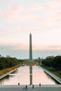 Gray Concrete Monument Near Green Trees Under White Clouds