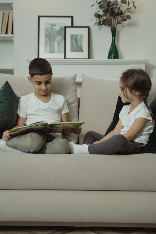 Siblings Reading a Book Together