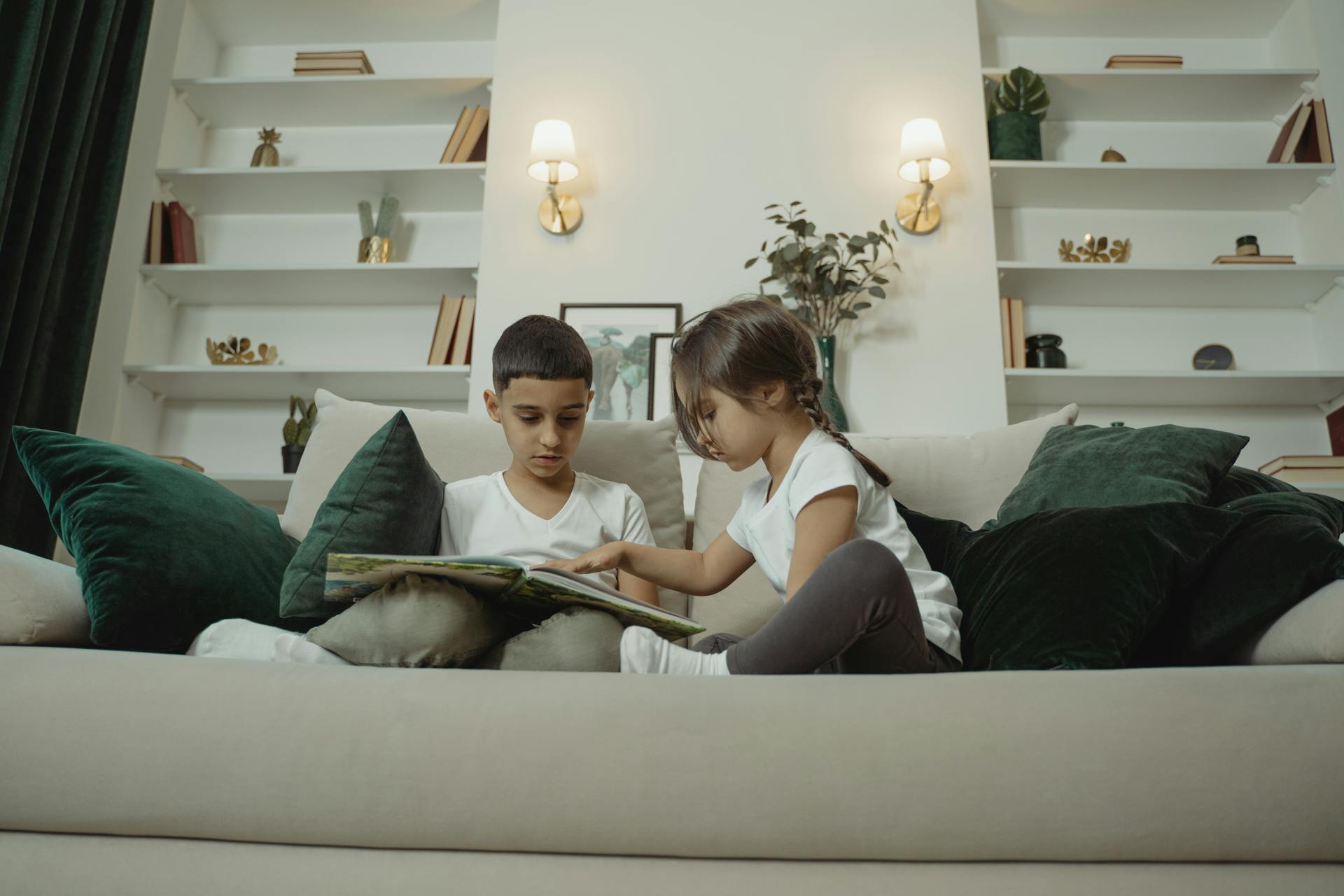 A Boy and Girl Reading the Book