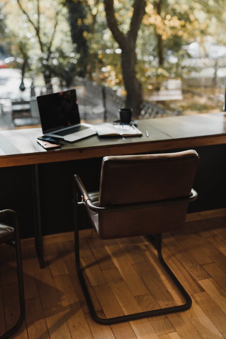 Steel  Framed Chair On Brown Wooden Floor