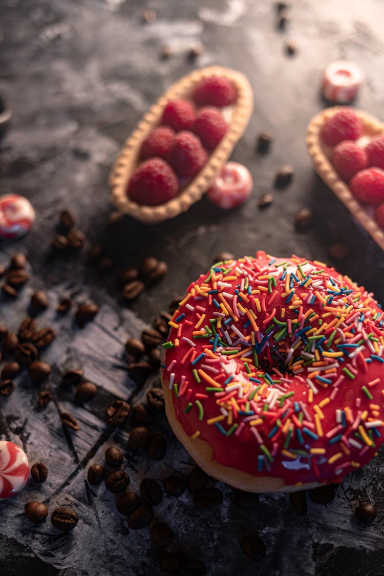 Doughnut With Red Icing And Sprinkles 