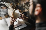 A Person Holding Notebook
