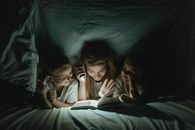 2 Women Lying on Bed