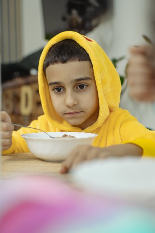 A Young Boy Eating Cereal 