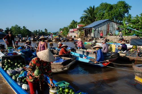 Free A vibrant scene at a floating market in Ho Chi Minh City, Vietnam, showcasing local culture and commerce. Stock Photo