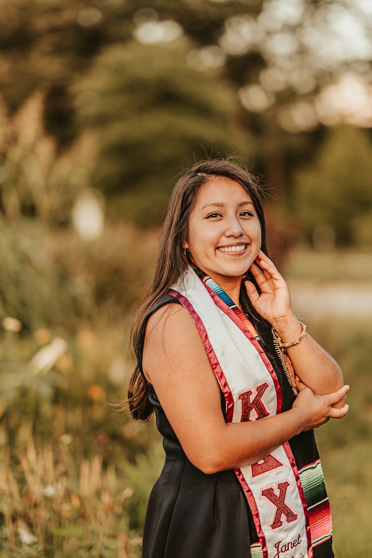 Positive Ethnic Woman In Traditional Scarf Of University Sorority