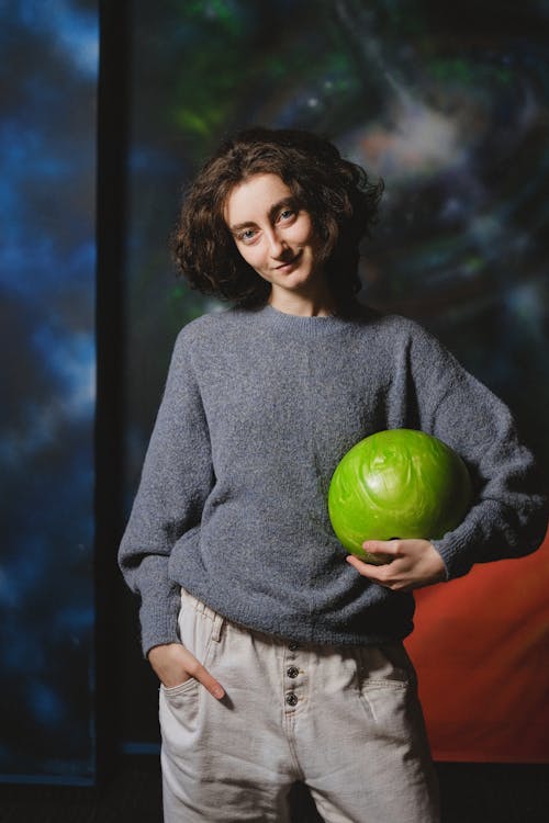 Woman Holding Green Bawling Ball
