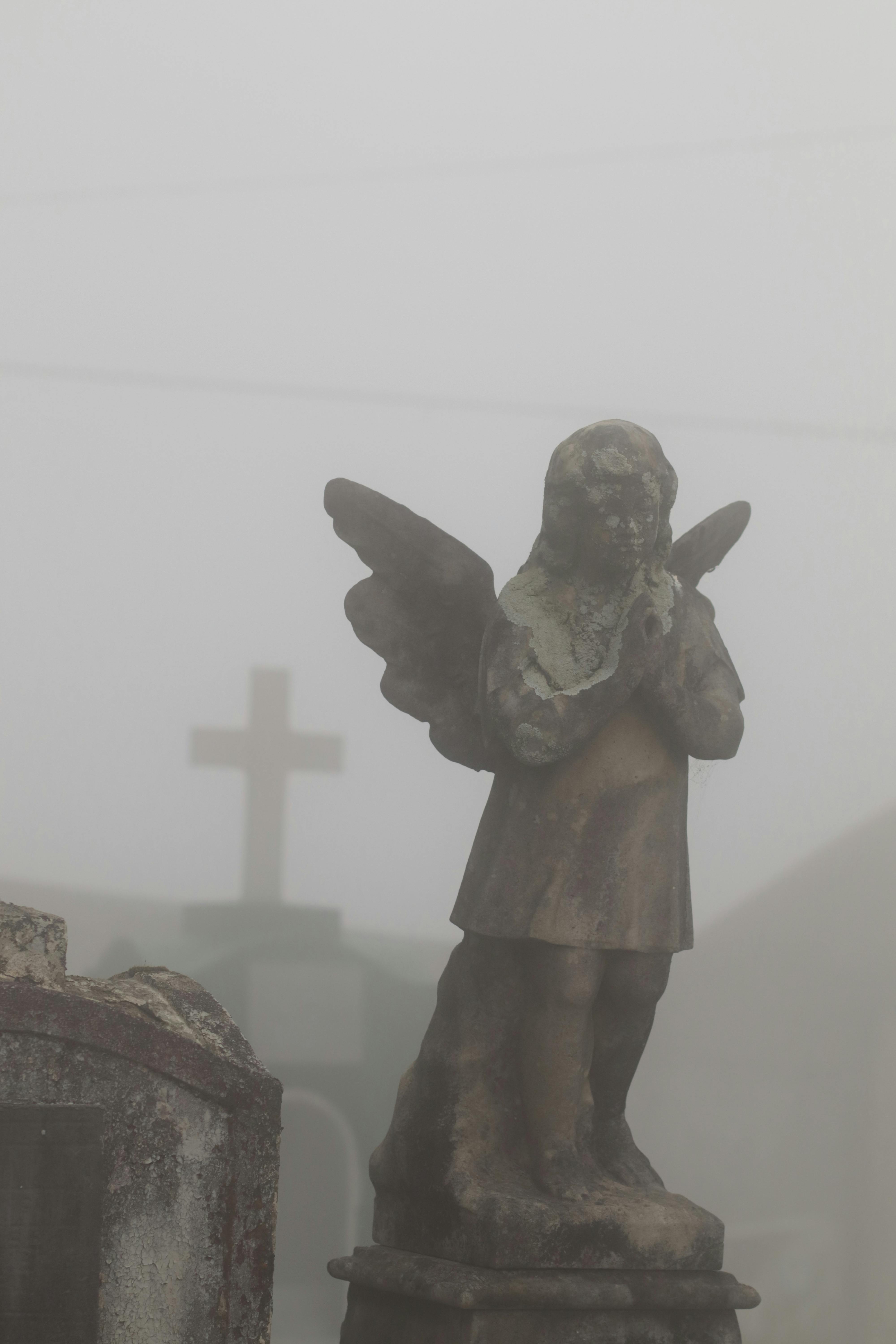 A Concrete Statue of an Angel · Free Stock Photo