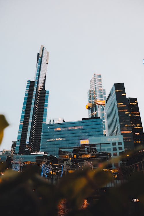 City Buildings With Lights during Night Time