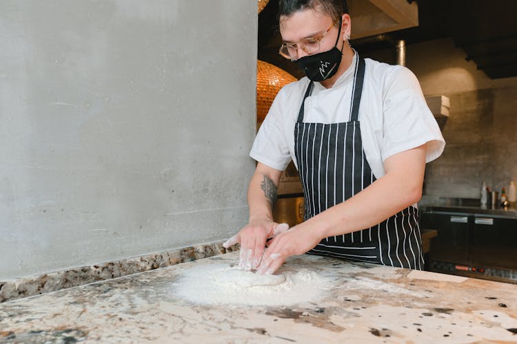 Man Holding Flour And Dough