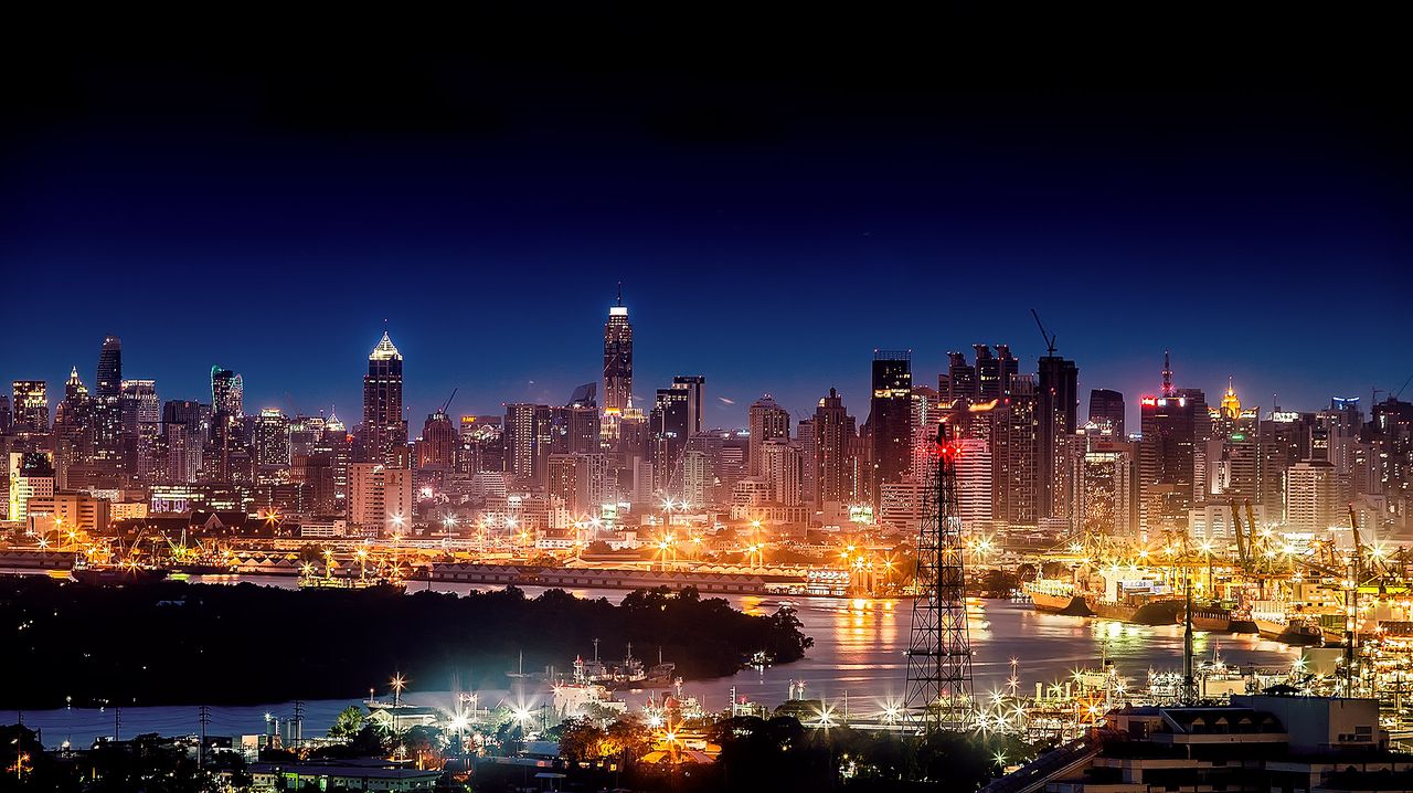 stunning night cityscape showcasing illuminated skyscrapers and a live