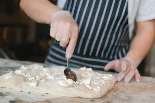 Pizzerman Preparing a Pizza