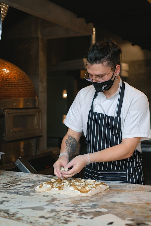 A Man Making a Pizza