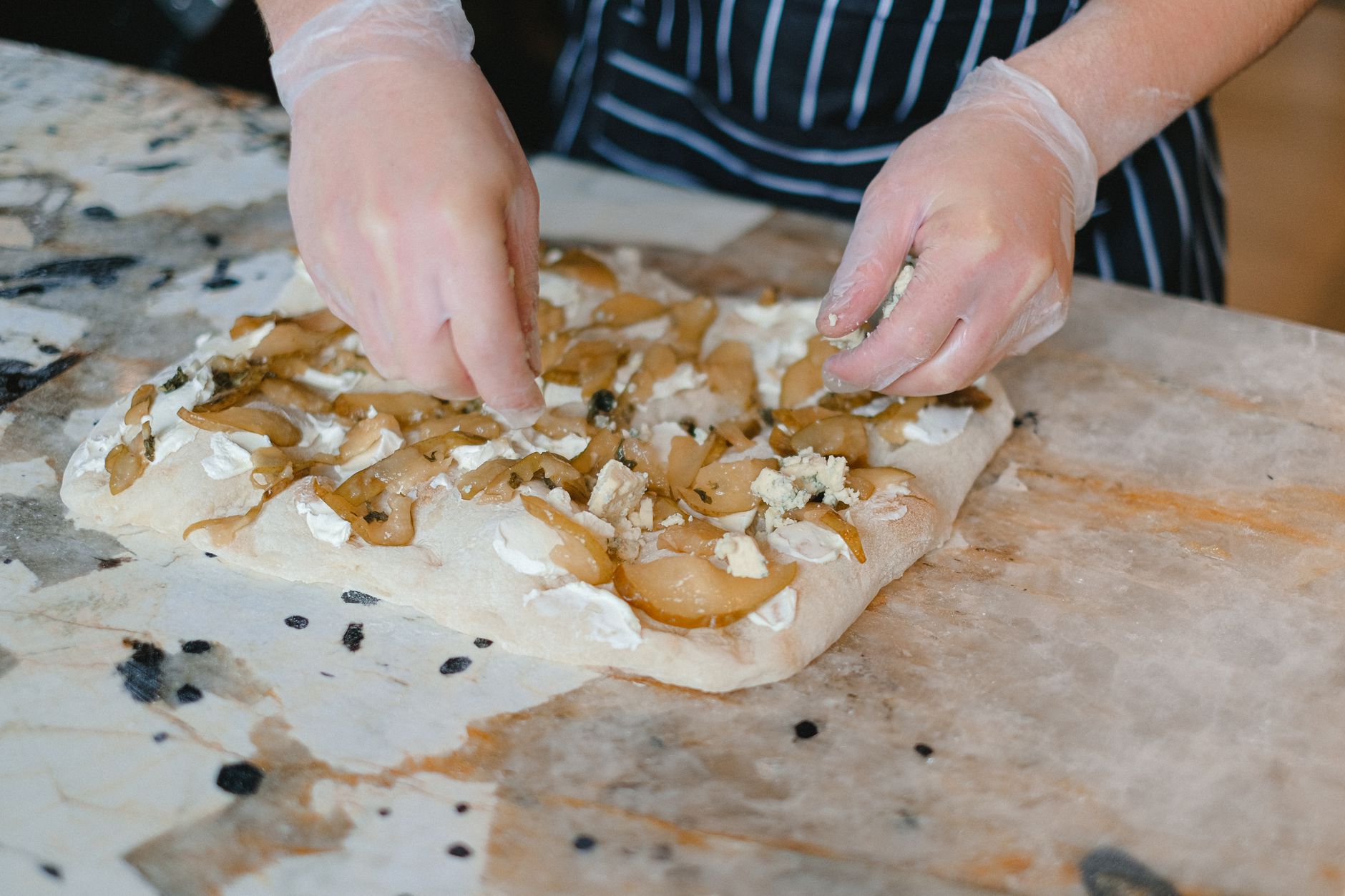 Freshly baked focaccia with blue cheese and honey drizzled on top
