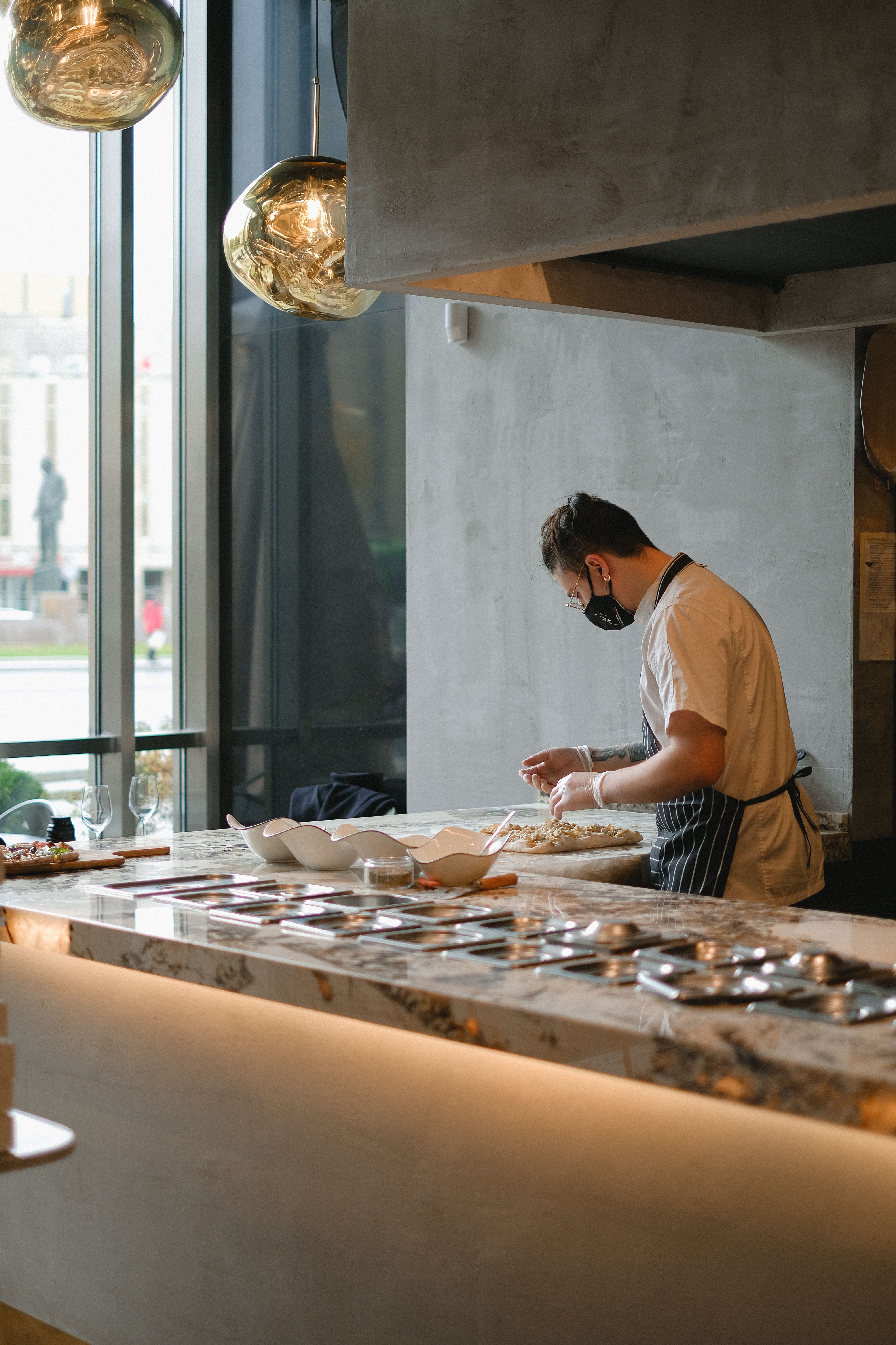 Cook Working in the Kitchen and Wearing a Face Mask · Free Stock Photo