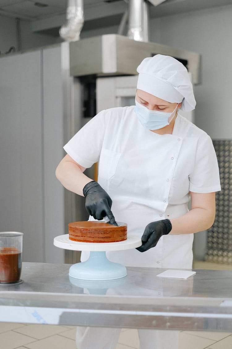 Woman Cutting A Cake