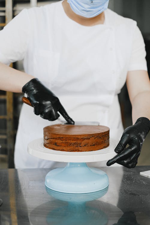 Free Person Icing a Cake  Stock Photo