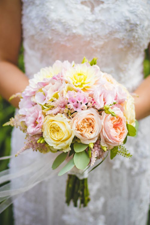 Free Bride Holding Bouquet of Flowers Stock Photo