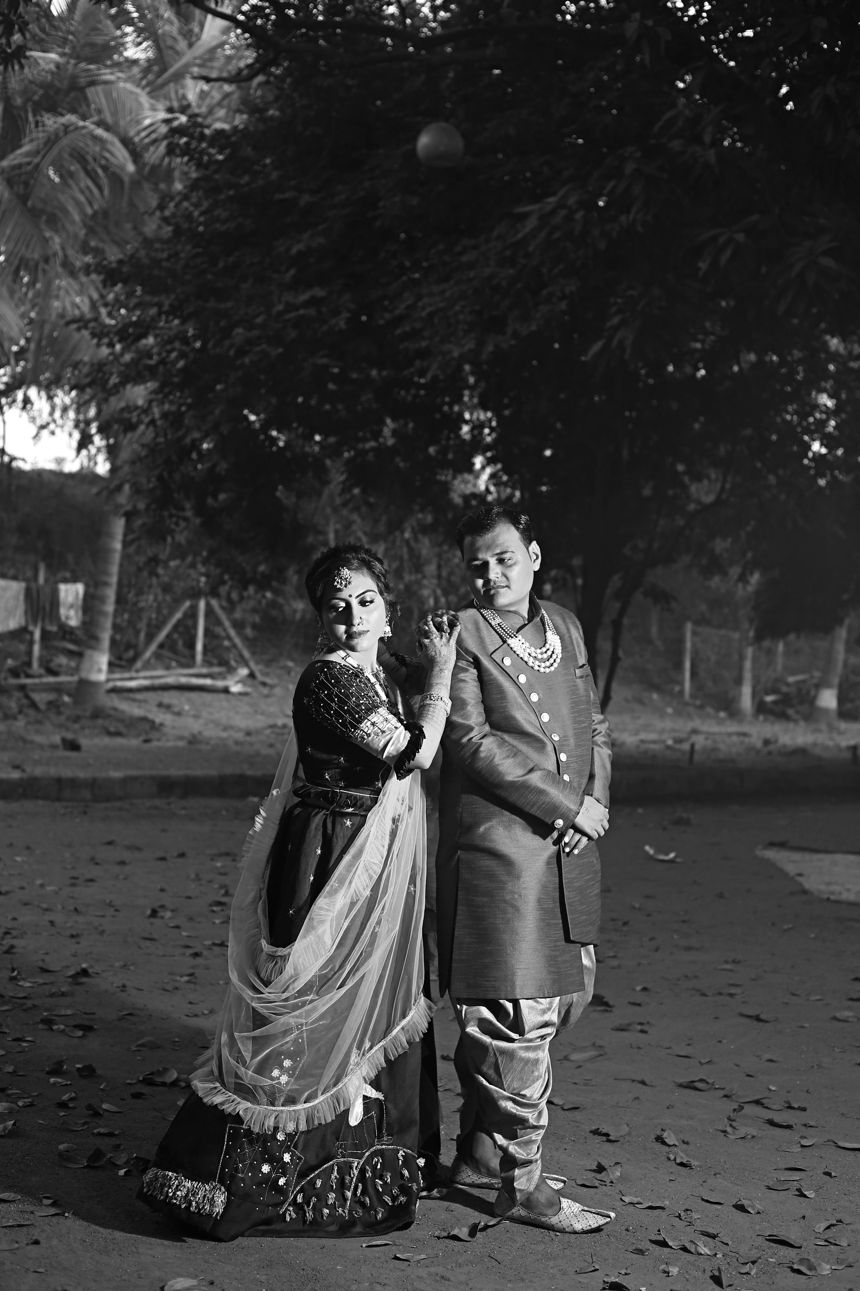 Grayscale Photo of Couple Kissing