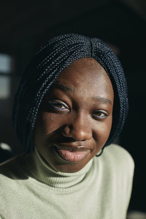 Free Close-Up Shot of Woman in White Turtleneck Shirt Smiling Stock Photo